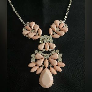 Soft pink costume jewelry short necklace.